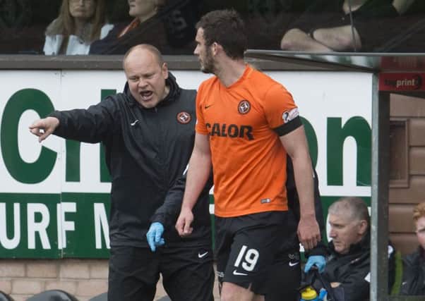 Gavin Gunning's Dundee United career ended shortly after he walked off the field with the ball in his hand, play still going on. Picture: SNS