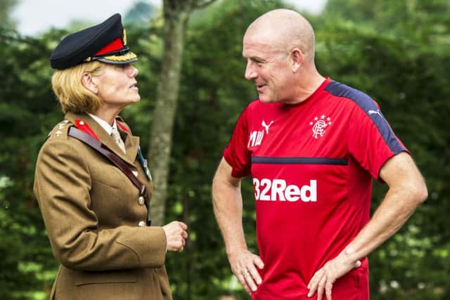 Rangers manager Mark Warburton with Col Stephanie Jackman to mark the signing of the Armed Forces Covenant to support serving personnel and veterans. Picture: Craig Williamson/SNS