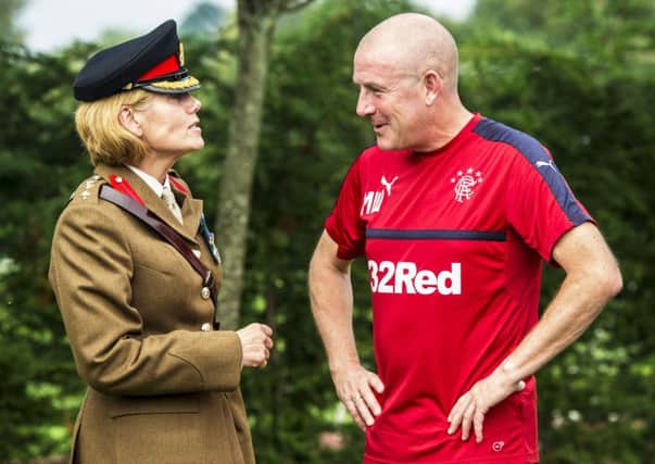 Rangers manager Mark Warburton with Col Stephanie Jackman to mark the signing of the Armed Forces Covenant to support serving personnel and veterans. Picture: Craig Williamson/SNS