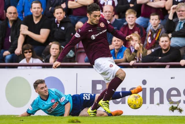 Hearts striker Tony Watt, right, has the ability to 'make something happen' every time he has the ball at his feet, according to his manager. Picture: SNS Group