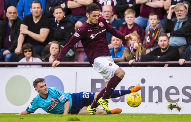 Hearts striker Tony Watt, right, has the ability to 'make something happen' every time he has the ball at his feet, according to his manager. Picture: SNS Group