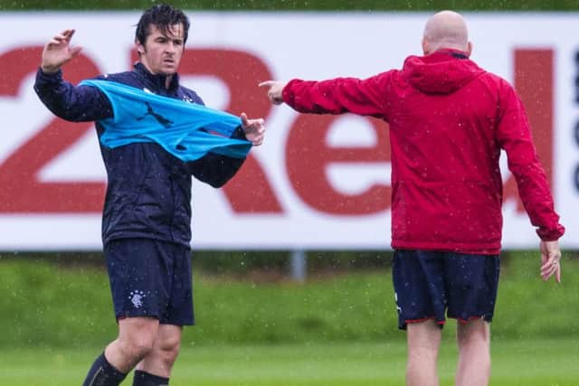 A row between Mark Warburton and Joey Barton, left, led to the latter's exodus from the Ibrox dressing room. Picture: SNS