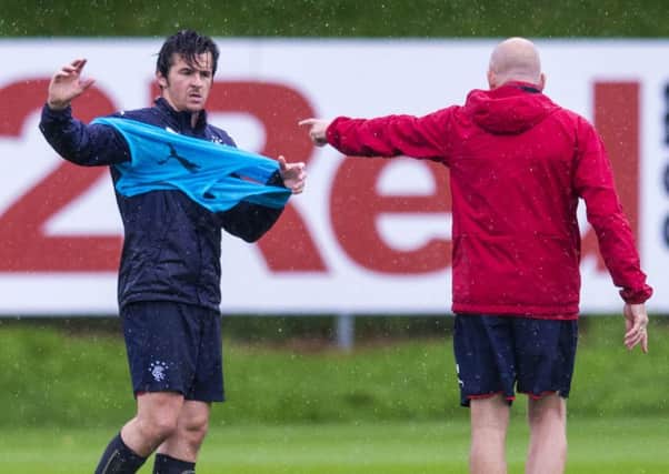 A row between Mark Warburton and Joey Barton, left, led to the latter's exodus from the Ibrox dressing room. Picture: SNS