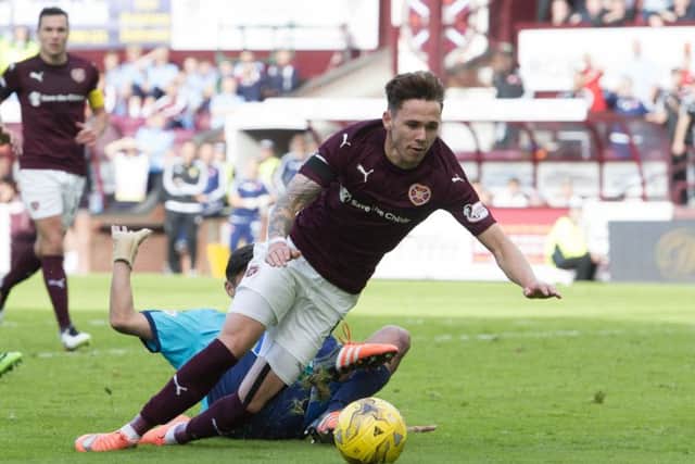 Tommy Wright believes Hearts players, like Sam Nicholson, "maximise any contact". Picture: SNS