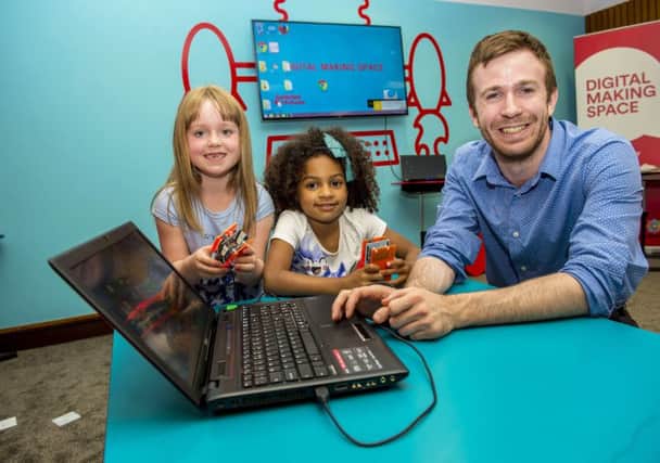 Dr Martin Goodfellow, Scottish amabassador for National Coding Week, with young coders Megan McArthur and Isabella Herbert. Picture: Bill Murray/SNS