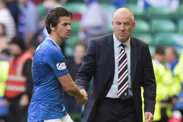 Rangers manager Mark Warburton (right) with Joey Barton after the loss to Celtic. Picture: SNS