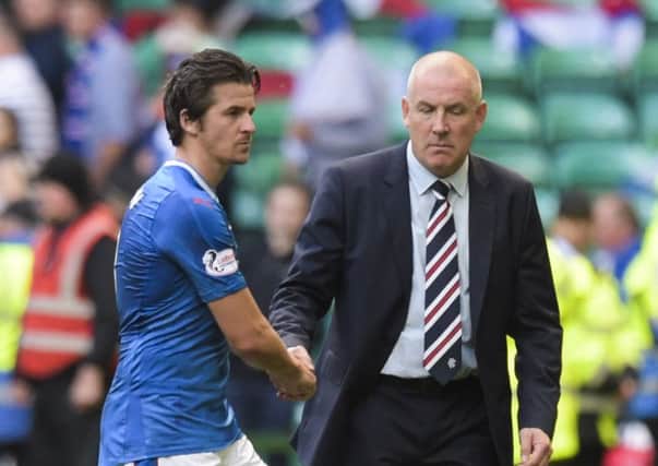 Rangers manager Mark Warburton (right) with Joey Barton after the loss to Celtic. Picture: SNS