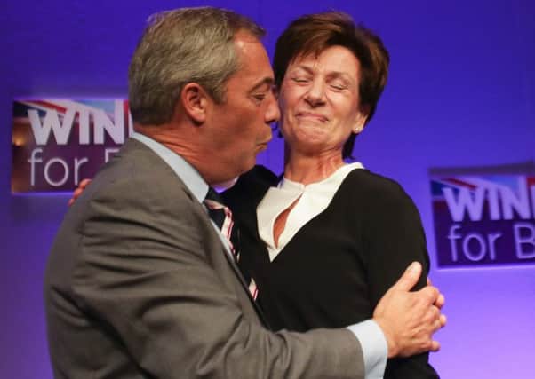 Outgoing leader Nigel Farage embraces new leader of the anti-EU UK Independence Party (UKIP) Diane James
Picture: Getty Images