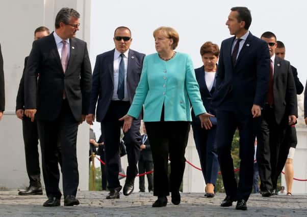 Leaders arrive for a group photo at the EU summit in front of Bratislava Castle, in Slovakia.