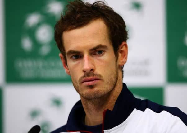 A solemn Andy Murray faces the media after his defeat. Picture: Clive Brunskill/Getty Images