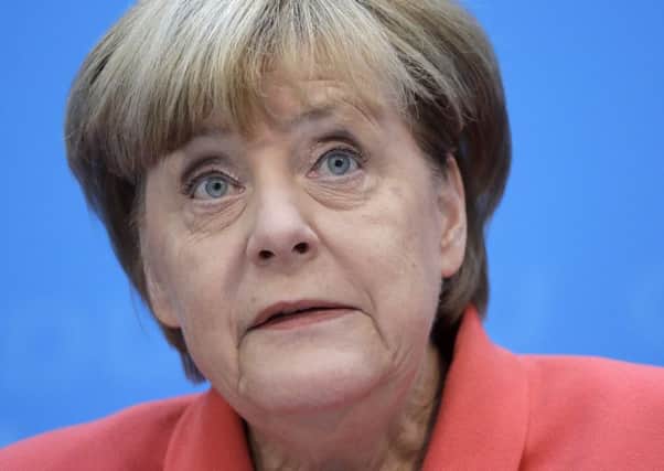Angela Merkel has pledged to work harder to address peoples concerns, particularly on migrants. Picture: AP