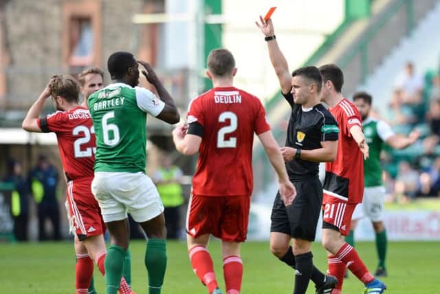 Marvin Bartley is shown a straight red card for a foul on Ayr midfielder Jamie Adams. Picture: SNS