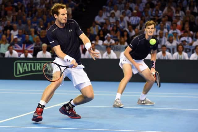Andy and Jamie Murray secured the win they needed yesterday in Glasgow. Photograph: Bill Murray/SNS Group