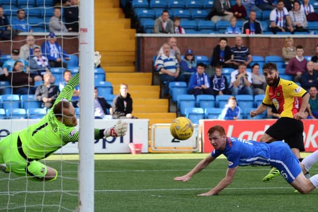 Partick's Steven Lawless fires the ball past Kilmarnock keeper Jamie MacDonald to make it 1-1. Pic: SNS