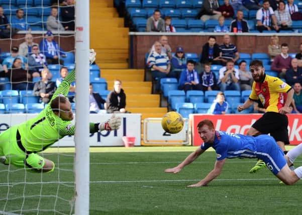 Partick's Steven Lawless fires the ball past Kilmarnock keeper Jamie MacDonald to make it 1-1. Pic: SNS