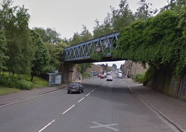 The incident took place on Dumbarton Road as the woman was walking under the railway bridge. Picture; Google.