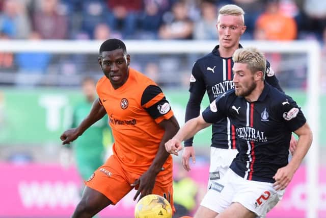 Lewis Kidd moves in for the ball ahead of Dundee Uniteds Tope Obadeyi.  Photograph: Paul Devlin/SNS