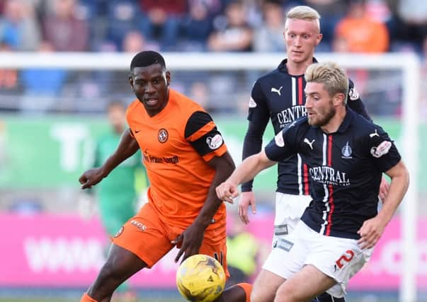 Lewis Kidd moves in for the ball ahead of Dundee Uniteds Tope Obadeyi.  Photograph: Paul Devlin/SNS