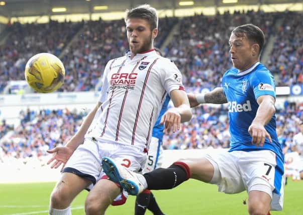 Ross County's Marcus Fraser, left, and Joe Garner tussle for possession during Saturday's stalemate at Ibrox. Picture: SNS