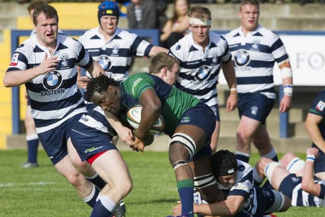 Boroughmauir No 8 Aubrey McCube offloads the ball as he is tackled. Picture Ian Rutherford