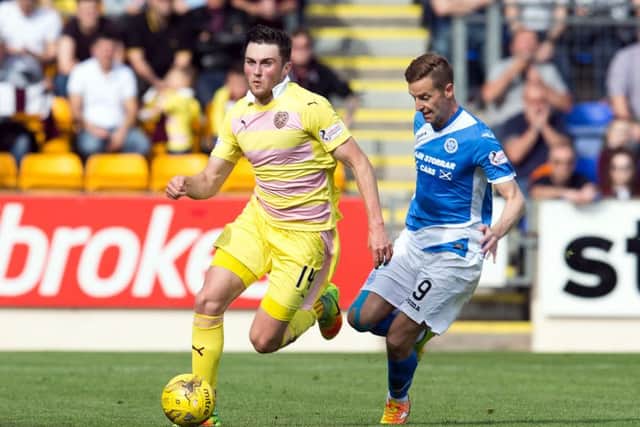 Hearts' John Souttar and St Johnstone's Steven MacLean in action at McDiarmid Park. Picture: SNS