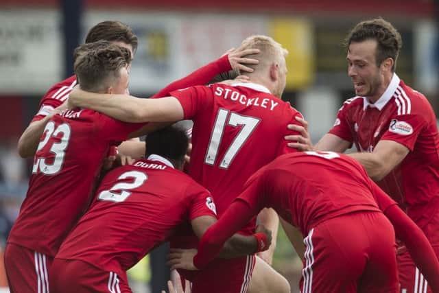 Aberdeen's Jayden Stockley celebrates his goal with team mates. Picture; SNS
