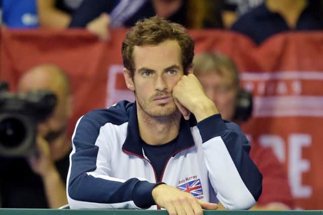 Andy Murray is left dejected after Dan Evans loses in four sets. Picture: SNS