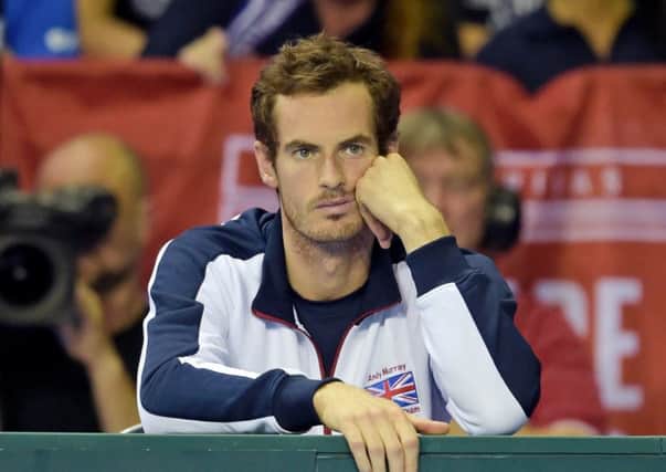 Andy Murray is left dejected after Dan Evans loses in four sets. Picture: SNS