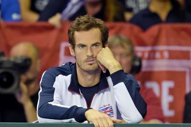 Andy Murray is left dejected after Dan Evans loses in four sets. Picture: SNS.