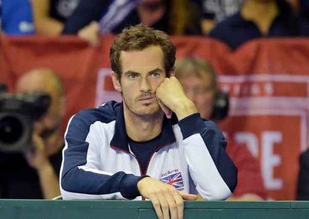 Andy Murray is left dejected after Dan Evans loses in four sets. Picture: SNS.