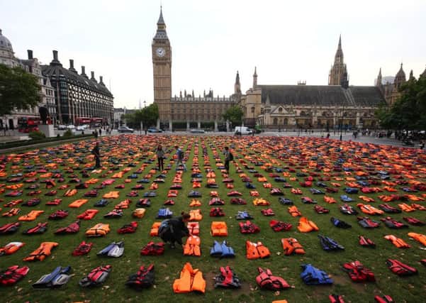 Parliament Square has been transformed into a 'graveyard of lifejackets'. Picture: SWNS