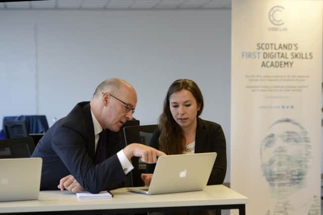 John Swinney with student Iwona Sztorc, at the official launch of CodeClan, an industry-led digital skills academy. Picture: Julie Bull/JP Resell