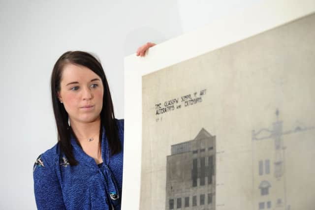 Lizzie O'Neill, colections managment assistant at the Huntarian with original Mackintosh plans. Pictures: John Devlin/TSPL