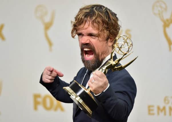 Actor Peter Dinklage, winner of Outstanding Supporting Actor for 'Game of Thrones', poses with his Emmy Award. Picture: Getty Images