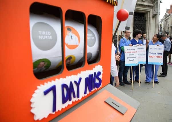 Junior doctors outside the Royal Courts of Justice in London on the first day of their hearing as they challenge the governments plan for a seven-day NHS service. Picture: Getty Images