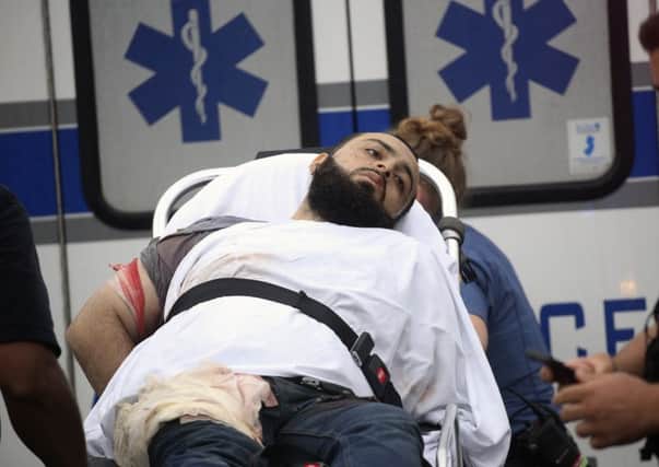 Wounded Ahmad Khan Rahami is taken into custody after a shootout with police. Picture: AP