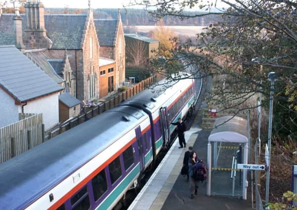 An image from the new book of an Inverness-Wick train about to leave Beauly Station in 2003. Picture: John Furnevel