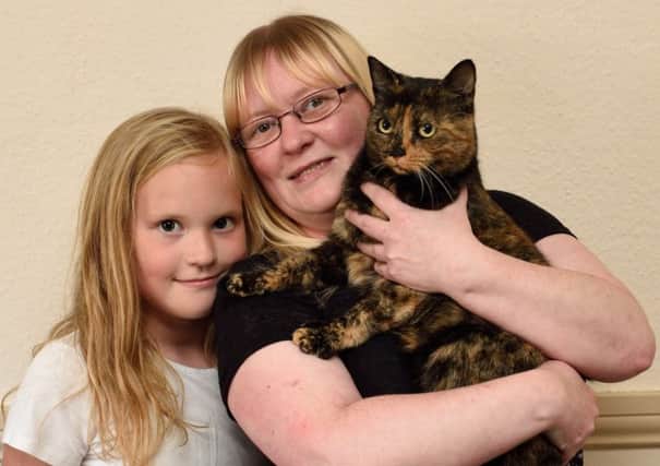 Wendy Boag and daughter Kerri Boag reunited with cat Daisy 
. Picture: Cascade