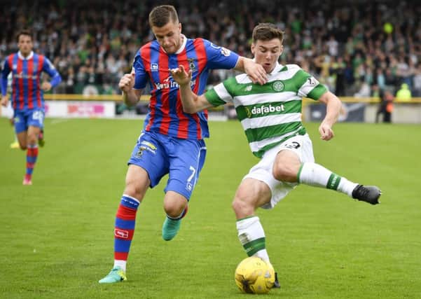 Celtic's Kieran Tierney, right, is determined to experience cup glory for the first time this season. Picture: SNS.