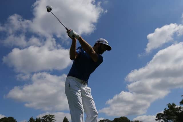 FedEx Cup leader Dustin Johnson tees off during a practice round for the Tour Championship at East Lake in Atlanta. Picture: Curtis Compton/Atlanta Journal-Constitution via AP