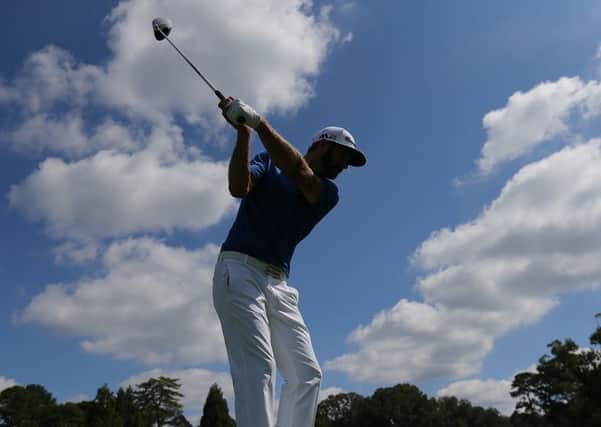 FedEx Cup leader Dustin Johnson tees off during a practice round for the Tour Championship at East Lake in Atlanta. Picture: Curtis Compton/Atlanta Journal-Constitution via AP