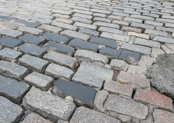 Residents called the tarmac on cobbles on Windmill Brae an act of vandalism. Picture: Ian Georgeson