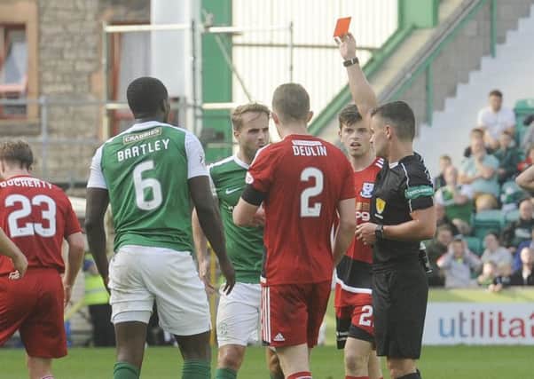 Marvin Bartley was shown a red card for the foul on Jamie Adams. Picture: Greg Macvean