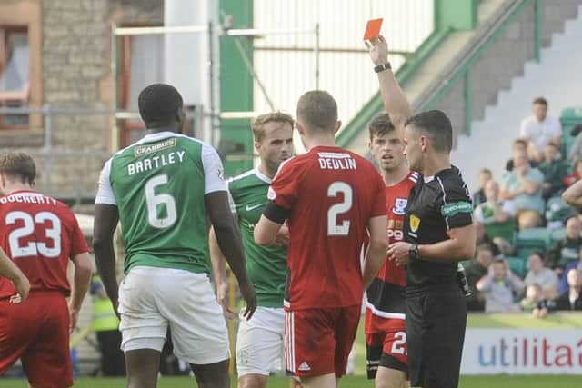 Marvin Bartley was shown a red card for the foul on Jamie Adams. Picture: Greg Macvean