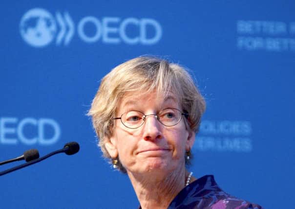 OECD chief economist Catherine Mann presents the think-tank's report at its Paris headquarters. Picture: Eric Piermont/AFP/Getty Images