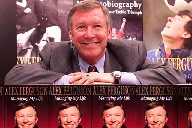 Alex Ferguson with his 1999 autobiography Managing My Life. Picture: PA