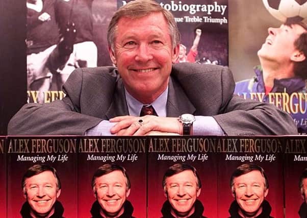 Alex Ferguson with his 1999 autobiography Managing My Life. Picture: PA