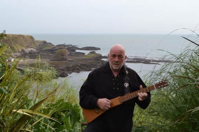 Historian and folk singer Dave Ramsay pictured just south of Catterline Bay, where the Bella crew were seized in 1916. The episode has inspired a new song for Ramsay, who will perform the work at a 100 year commemoration event at the weekend. PIC Alison Campsie.