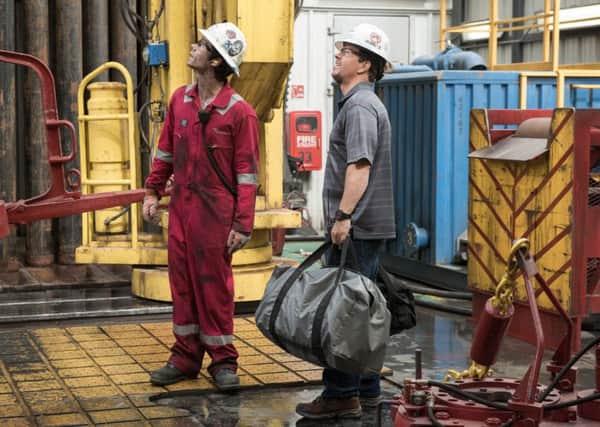 Dylan O'Brien and Mark Wahlberg in Deepwater Horizon