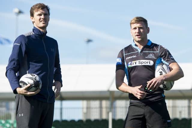 Jamie Murray, left, visited Warriors' training at Scotstoun and is pictured with Glasgow's Finn Russell. Picture: Paul Devlin/SNS Group